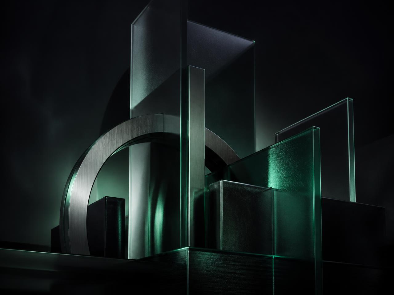 Abstract frosted glass monoliths and brushed metal arches with emerald light, representing institutional leadership